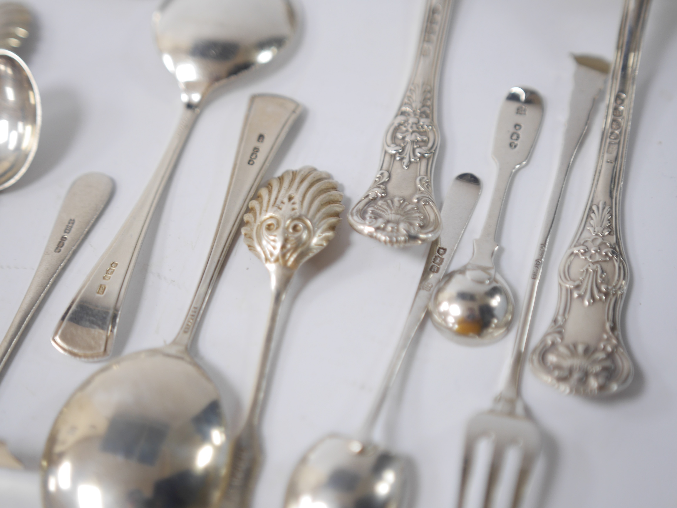 A quantity of assorted mainly 19th century and later silver flatware, including two Queens pattern sauce ladles, seventeen teaspoons, six mustard ladles, a toddy ladle, etc, and a silver pencil holder, various dates and